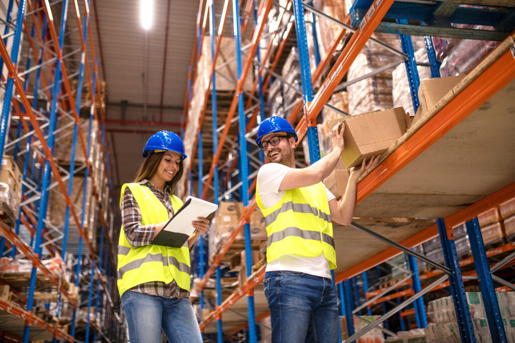 temporary warehouse workers stocking shelves at a warehouse